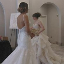 two women in wedding dresses