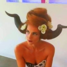 woman with a hairstyle representing horns