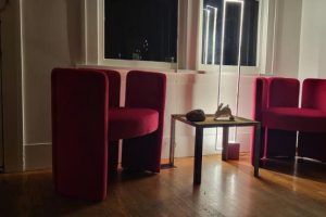 sitting area with red furniture